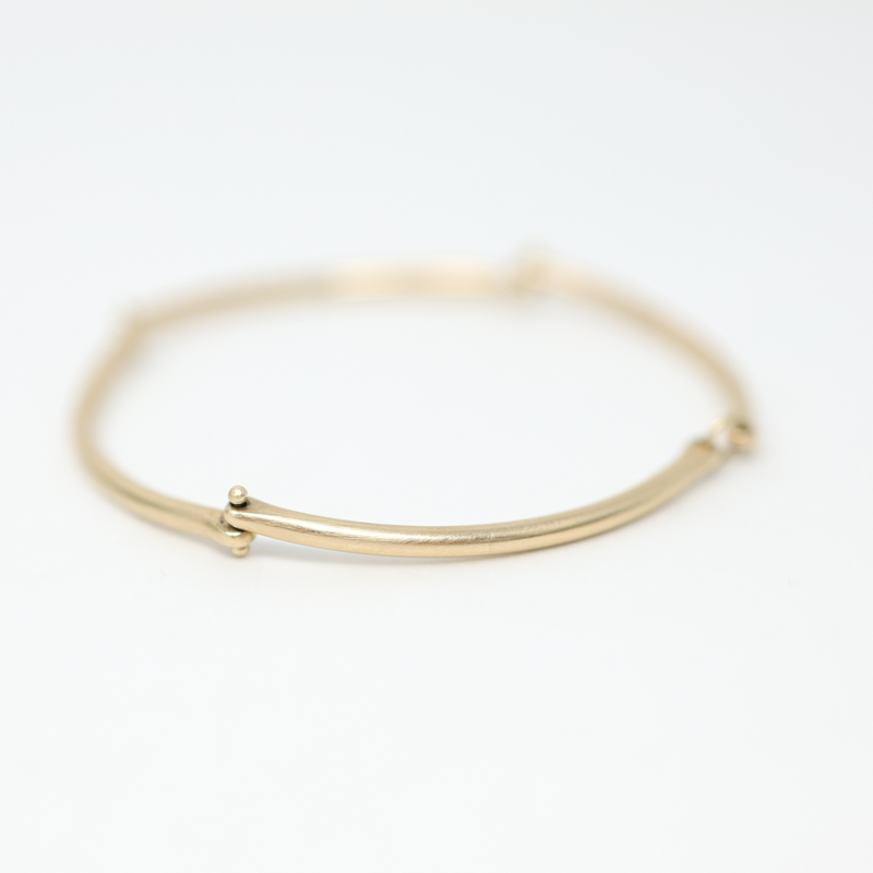 Hilary Finck rivet and ring bangle bracelet in 14k yellow gold