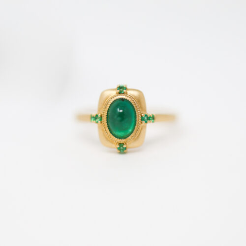 oval emerald cabochon yellow gold engagement ring